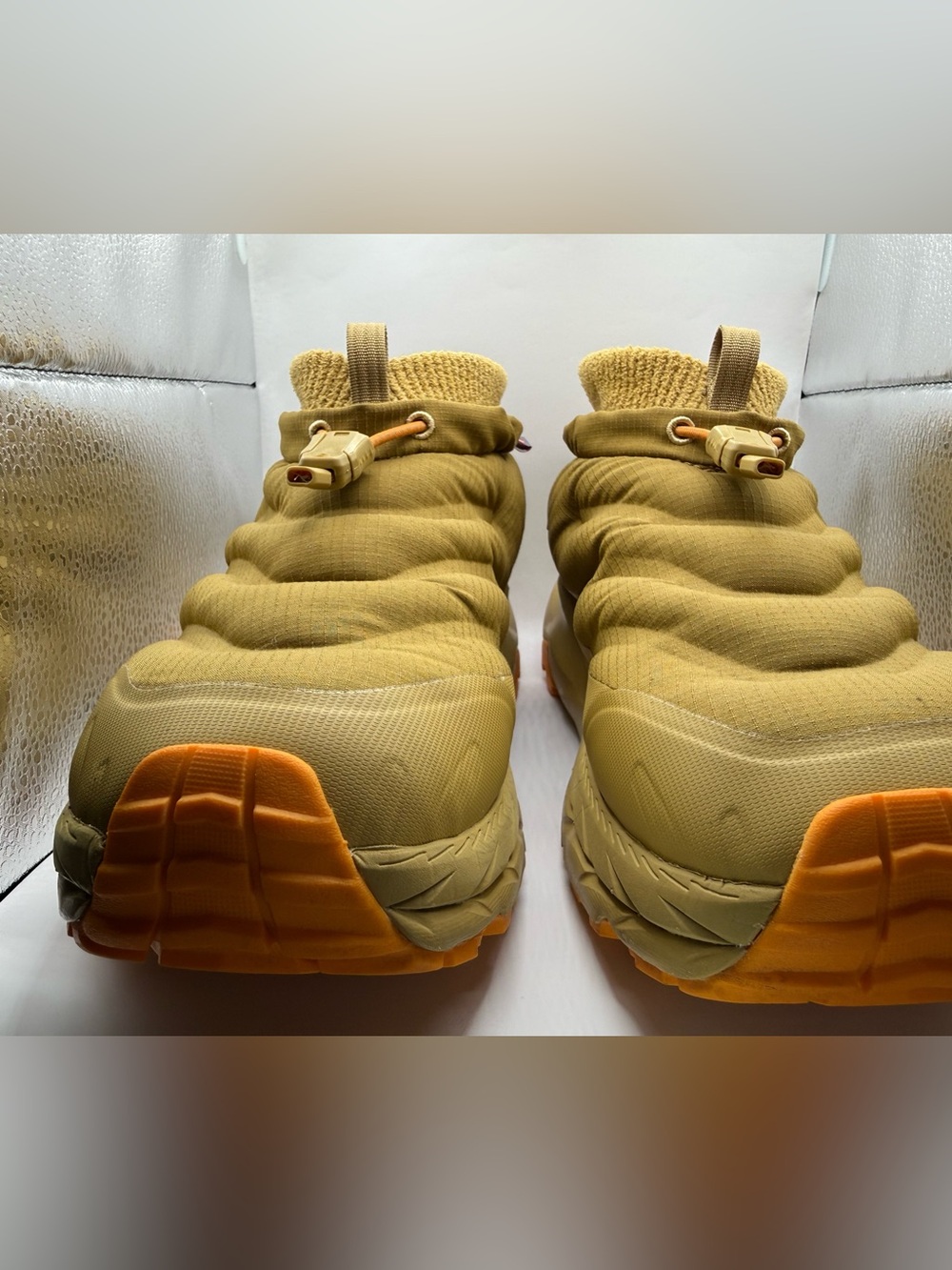 Hoka Puffer kaha Slip-On Sneakers in tan with Orange Soles